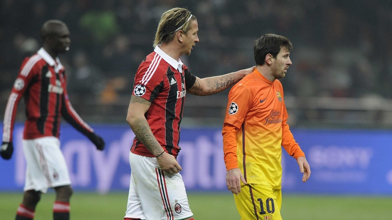 Lionel Messi of FC Barcelona and Philippe Mexes of AC Milan