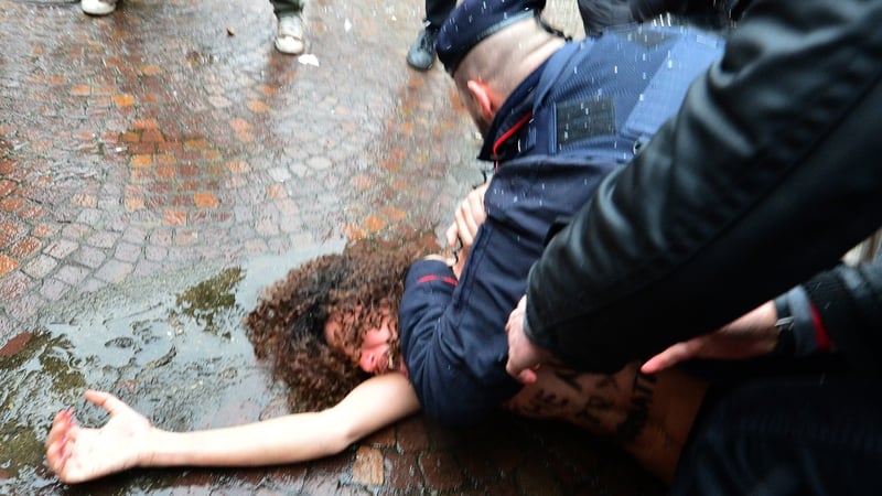 Police tackled the women and took them away