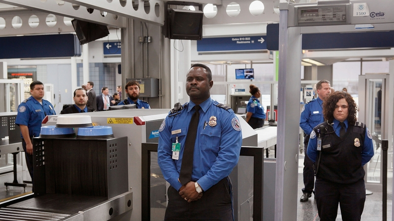 TSA staff at a security point in Chicago's O'Hare Airport