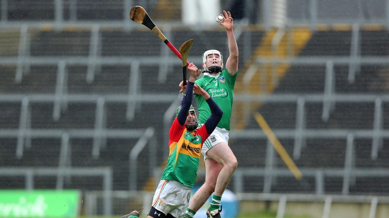 Craig Doyle of Carlow with Tom Condon of Limerick