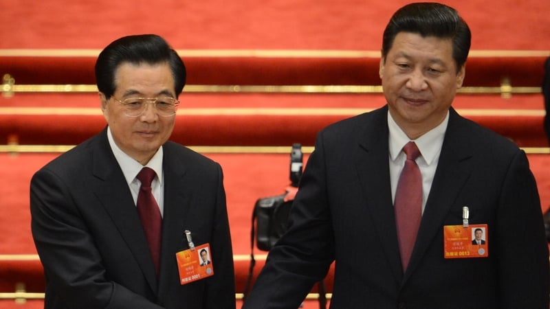 Xi Jingping (l) is congratulated by former leader Hu Jintao