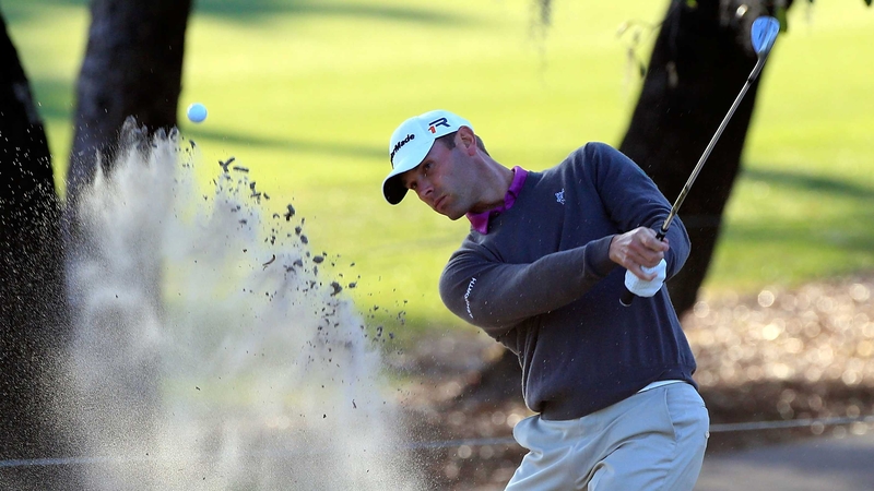 Shawn Stefani plays from the sand on the fifth hole