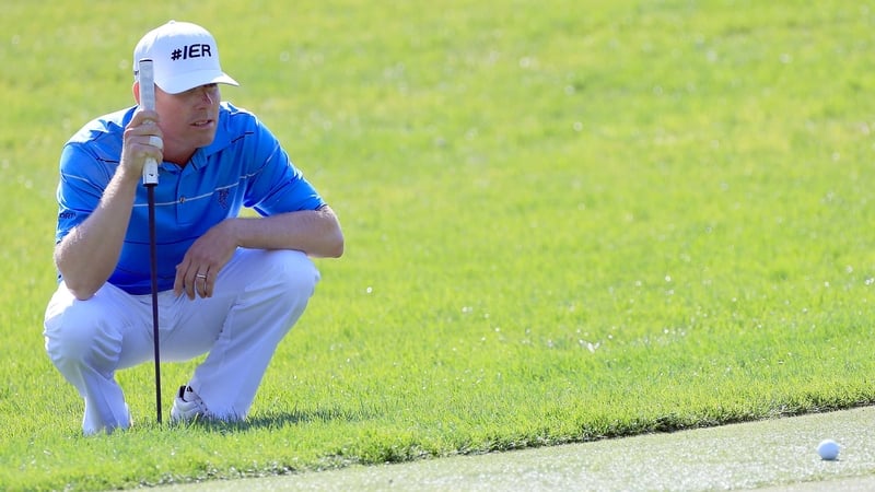 Leonard studies his ball on the 15th green