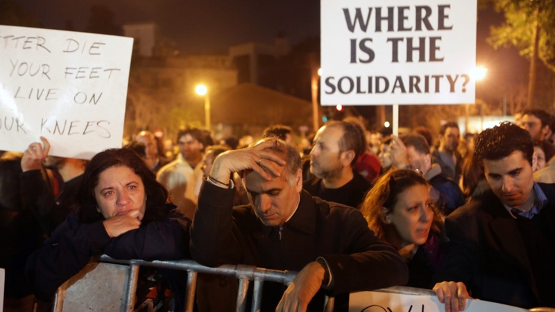 Cypriots protest in Nicosia as the government tries to confront the island's financial crisis