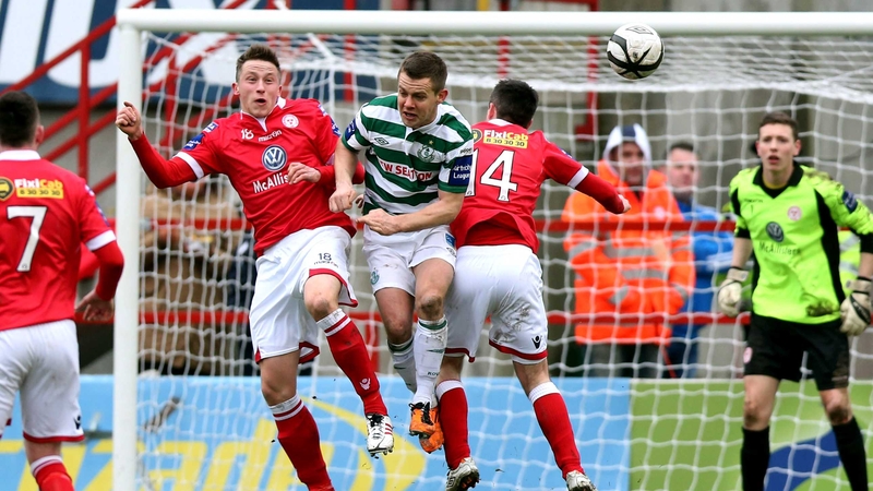 Shane Robinson of Shamrock Rovers with Robert Cornwall and Robert Bayly of Shelbourne