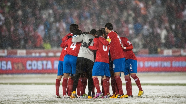 Costa Rica’s players enter a huddle, possibly for warmth as much as anything else, at Dick's Sporting Goods Park