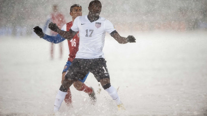 Jozy Altidore of the United States and Costa Rica’s Diego Calvo battle for possession in dire conditions in Commerce City, Colorado