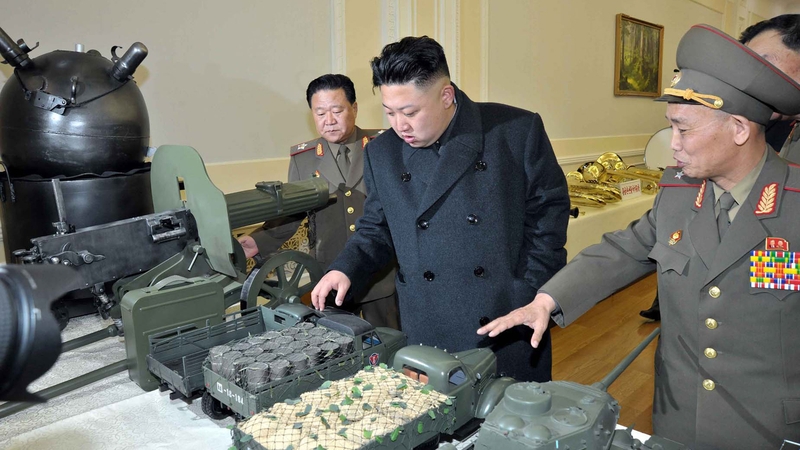North Korean leader Kim Jong-Un inspects model military vehicles in a photo released this week