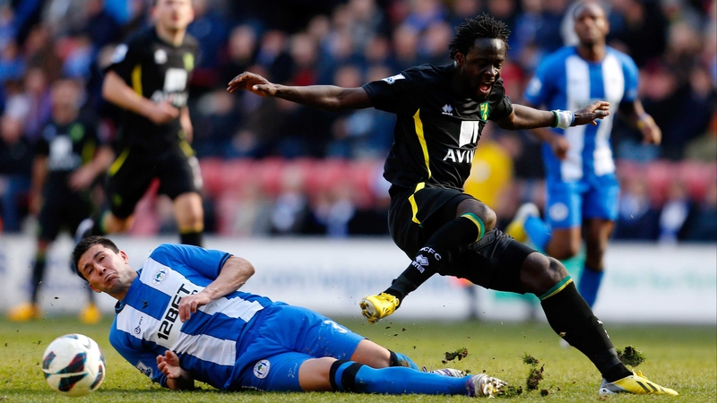 Wigan's Antolin Alcaraz slides in on Kei Kamara