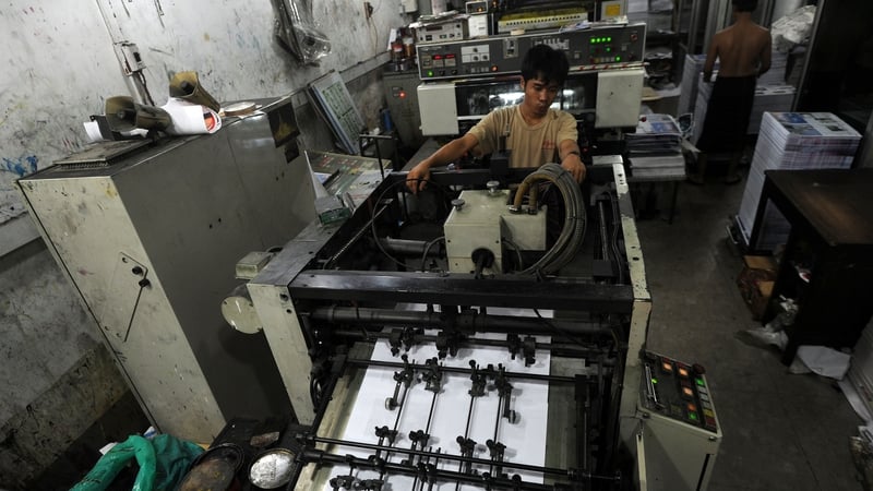 An employee monitoring the printing of newspapers at a printing house in Yangon last month