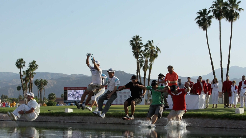 Inbee Park and team celebrate by jumping into Poppie's Pond