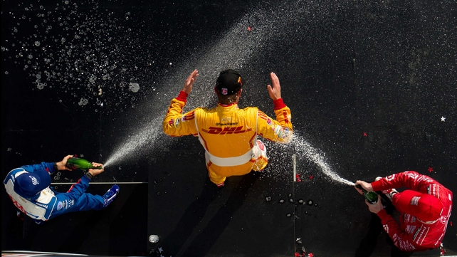 Ryan Hunter-Reay gets sprayed with champagne after winning the Honda Indy Grand Prix of Alabama at Barber Motorsports Park