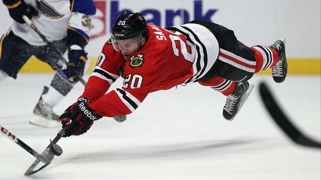 Brandon Saad of the Chicago Blackhawks dives for the puck against the St. Louis Blues at the United Center, Chicago