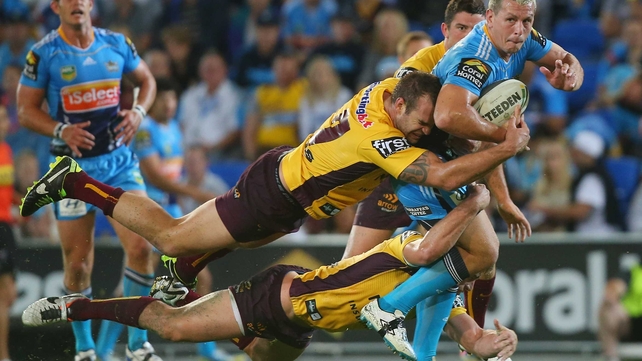 Greg Bird of the Titans is double-tackled during the NRL match between the Gold Coast Titans and Brisbane Broncos at Skilled Park