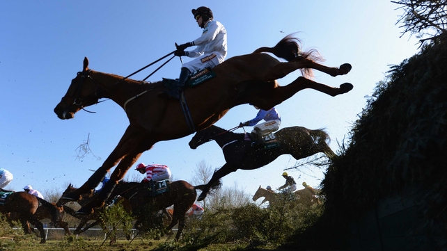 Horses clear the infamous Becher's Brook at the Aintree Grand National
