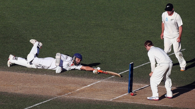 Monty Panesar of England dives into his crease ahead of the ball against New Zealand at Eden Park, Auckland