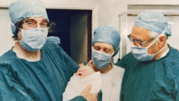 Prof Robert Edwards (L) holding the world's first test tube baby, Louise Joy Brown