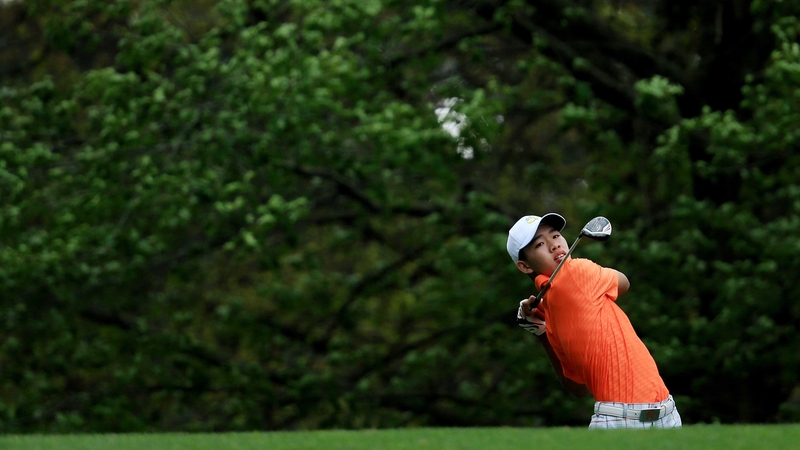 Guan Tianlang hits his tee shot on the fourth hole during the second round of the Masters