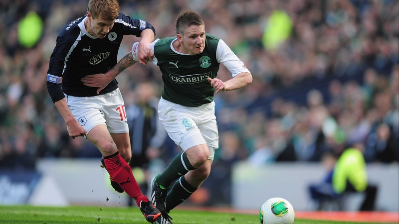 Jay Fulton of Falkirk battles with Paul Cairney of Hibernian