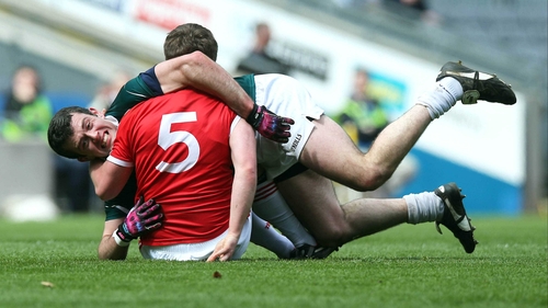 Padraig O'Neill of Kildare with Dermot Carlin of Tyrone
