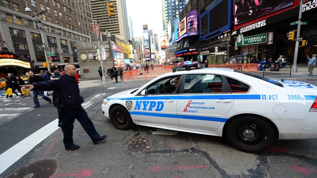 New York Police Department officers gather at the edge of Times Square in Manhattan in NYC