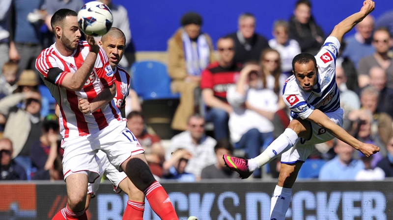 Marc Wilson and Jon Walters close down Andros Townsend
