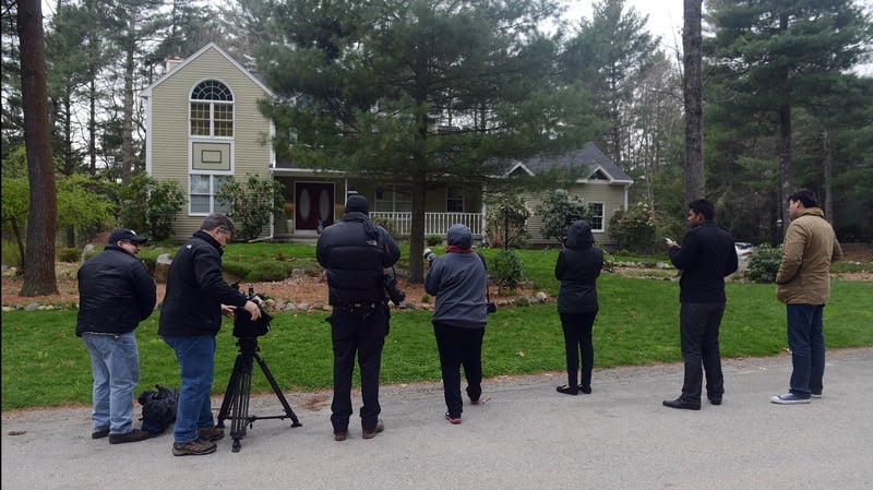 News media wait outside the home of Warren and Judith Russell, where their daughter Katherine Russell, the widow of Tamerlan Tsarnaev, is staying