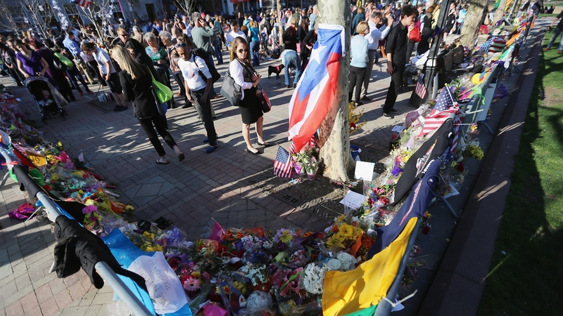 People gather at a makeshift memorial on Boston's Copley Square, near the scene of the bombings