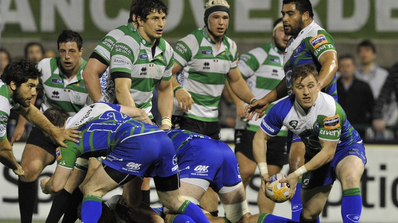 Paul O'Donohoe offloads the ball in Italy