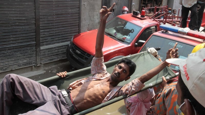 A Bangladeshi survivor reacts after he was recovered, 60 hours after the collapse
