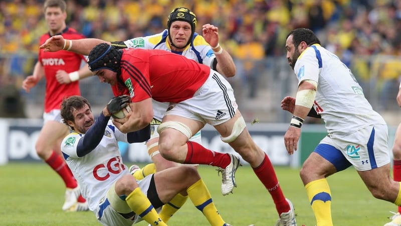 Tommy O'Donnell of Munster is tackled by Brock James (left), Julien Bonnaire (centre) and Davit Zirakashvili (right)