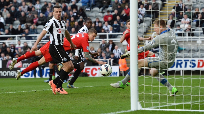 Jordan Henderson's free-kick skips past the dive of Daniel Agger and into the Newcastle net