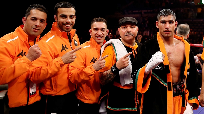 Amir Khan celebrates victory over Julio Diaz