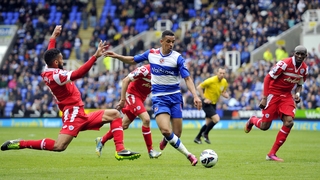 Reading's Nick Blackman unleashes a shot as Queens Park Rangers' Senegalese defender Armand Traore tries to block the ball