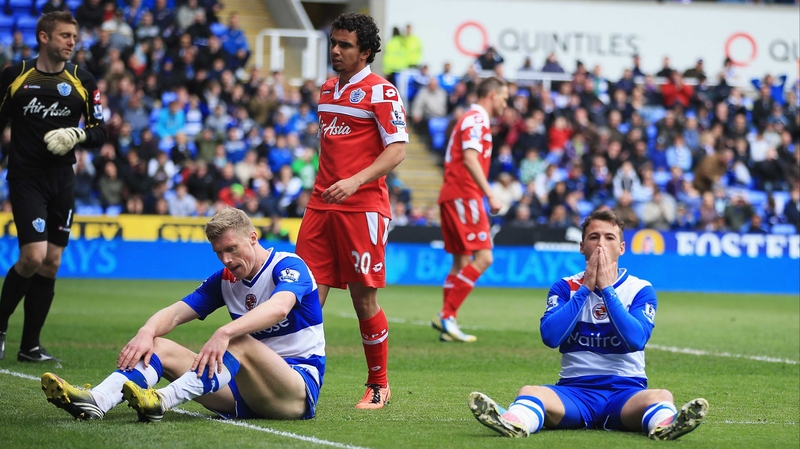 Reading's Pavel Pogrebnyak and Adam Le Fondre look dejected after a draw which condemned them to the Championship