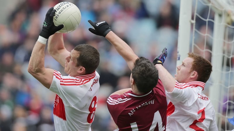Derry's Patsy Bradley and Aidan McAlynn with Ciaran Curley of Westmeath