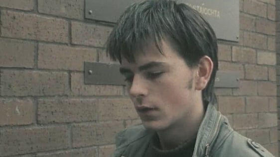 A young man outside and employment exchange talks to RTÉ News about emigration in 1982.