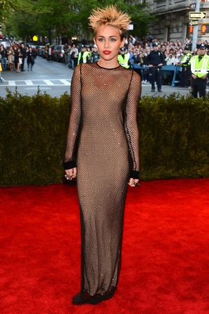 Miley Cyrus attends the 2013 Met Ball. The theme of 'PUNK: Chaos to Couture was perfect for the singer.