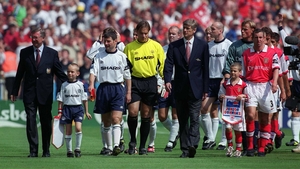 Leading his team out alongside captain Denis Irwin and long-time rival Arsene Wenger for the Charity Shield in '99