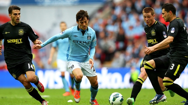 Action from the 2013 Cup final involving Wigan and Man City