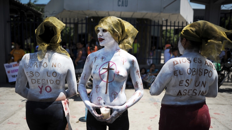 Members of feminist organisations demonstrate in favour of abortion outside the Courthouse of San Salvador
