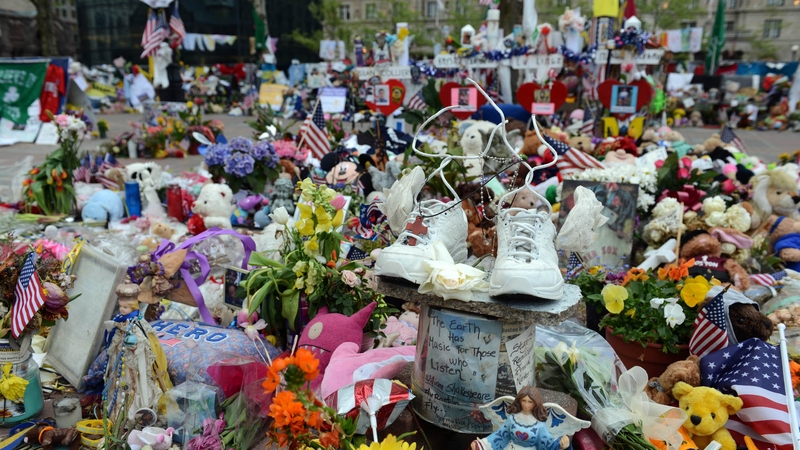 Mr Kenny visited the temporary memorial on Boylston Street in Boston