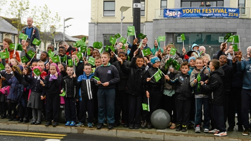 A group of chilrdren in Longford town cheer on the riders at the start of stage two