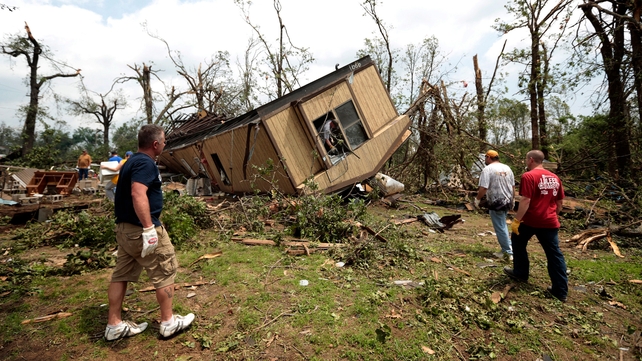 Volunteers help clean out Jean McAdams' mobile home in Shawnee