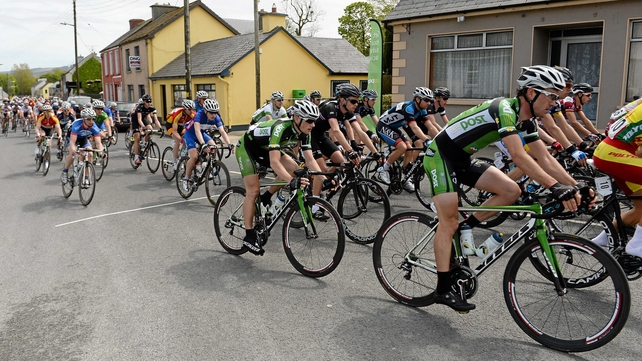 Eventual stage winner Sam Bennett (centre) passes through the village of Athea, Co Limerick