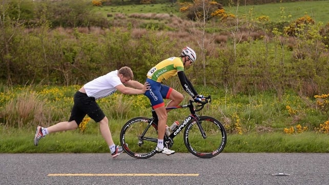 Marcin Bialoblocki (Britain UK Youth Pro Cycling) gets a push after a change of bike at Farranfore, Killarney, Co Kerry