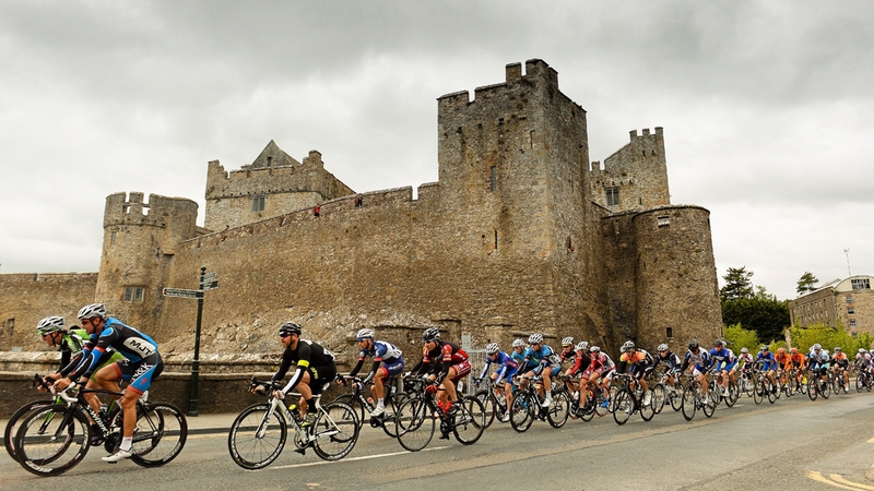 The peloton takes a leisurely spin past Cahir Castle in Co. Tipperary.
