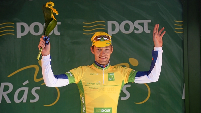 Marcin Bialoblocki salutes the crowd in Naas as he retains the yellow jersey.