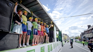 The jersey holders wave to the crowd following the presentation ceremony.