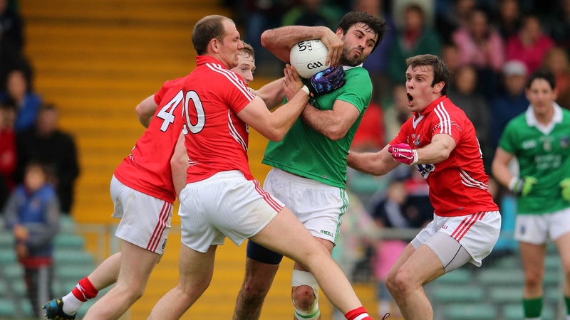 Limerick's John Galvin comes under intense pressure from the Cork duo of Alan O'Connor and James Loughrey